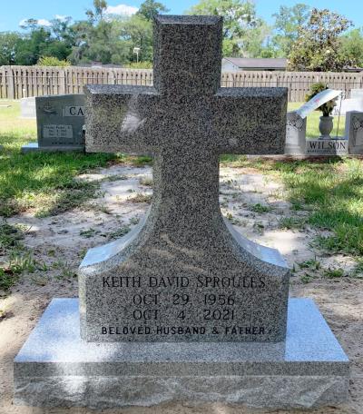 gray granite upright cross headstone